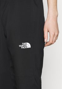 The North Face Träningsbyxor - black
