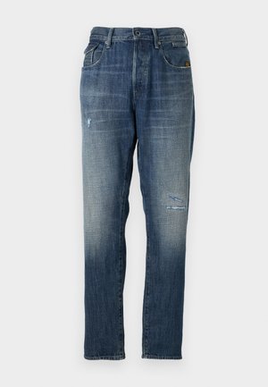 Denim jeans featuring a faded blue color, a straight leg design, moderate distressing on the front, and a classic five-pocket style.