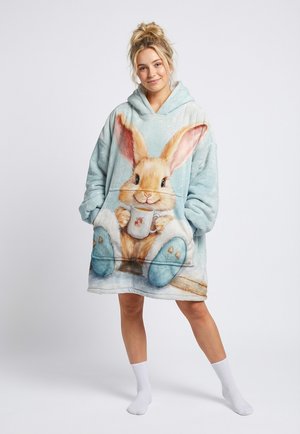 Fliiselisest materjalist kapuutsiga pusa, millel on suur pehme toonides küülikugraafika, esist tasku ja mugav disain, ideaalne lõõgastumiseks.