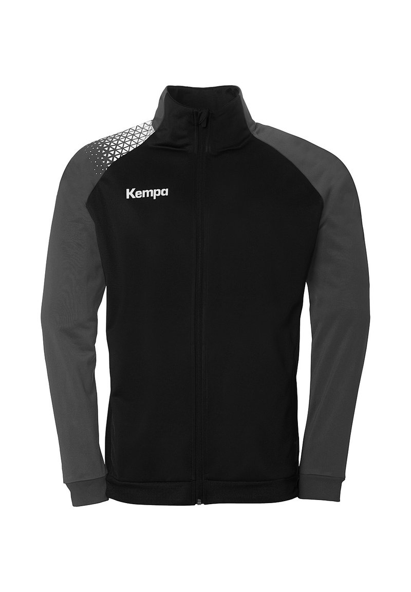 Black jacket with gray long sleeves and geometric pattern on upper left. Features a full zipper and "Kempa" logo on the chest. Flexible fabric.