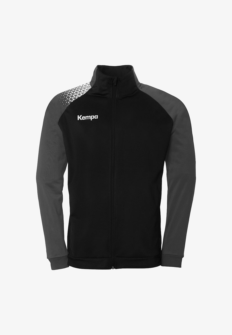 Black jacket with gray long sleeves and geometric pattern on upper left. Features a full zipper and "Kempa" logo on the chest. Flexible fabric.