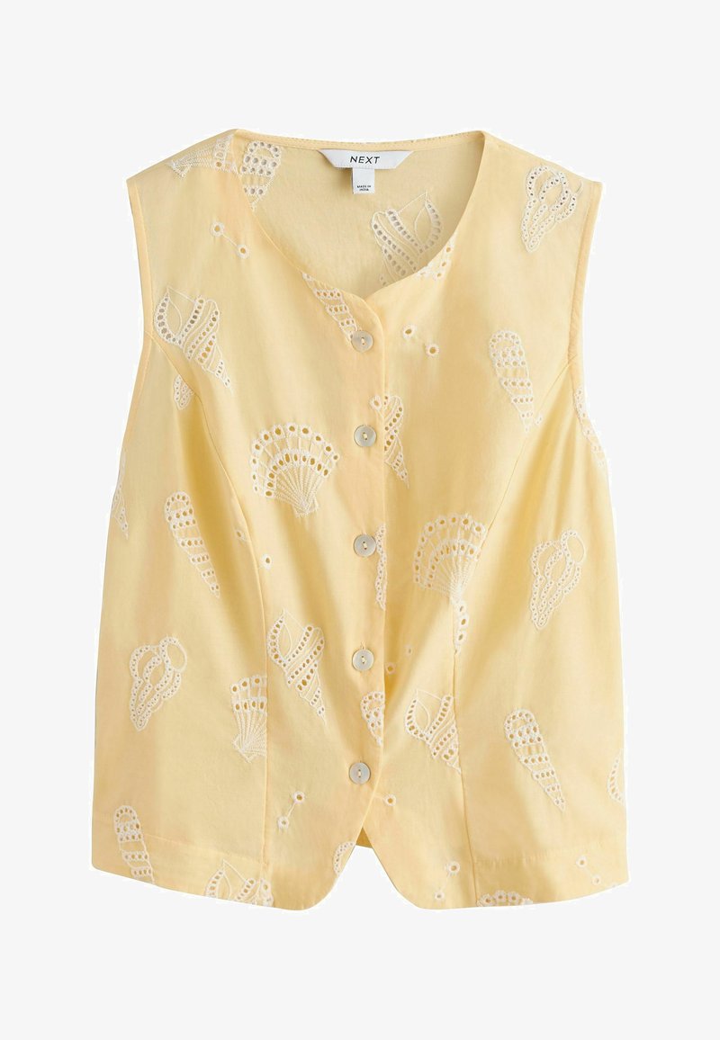 Blouse sans manches jaune pâle avec boutons, ornée de motifs brodés de coquillages blancs et d'un col rond.