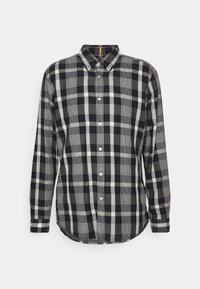 Koszula na guziki z wzorem w czarno-białą kratę. Wykonana z gładkiej tkaniny, posiada klasyczny kołnierz i zaokrąglony dół.