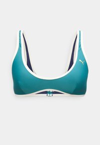 Μπλε σπορ σουτιέν με λευκή επένδυση, εσωτερική φόδρα σε σκούρο μπλε, μπροστινό κούμπωμα και μικρό χρυσό λογότυπο Puma στην αριστερή πλευρά.