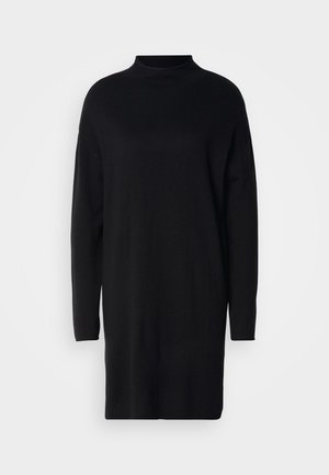 Abito in maglia nera con collo alto, maniche lunghe e vestibilità morbida. Texture liscia e design a metà lunghezza, adatto per essere indossato a strati.