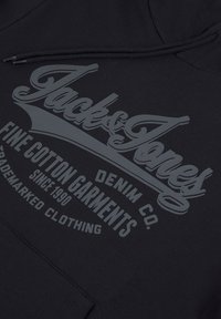 Black cotton hoodie featuring a large, tone-on-tone graphic print. Text includes "Jack & Jones" and additional brand details.