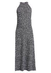 Black halter dress featuring a white leopard print. Flowing silhouette with a fitted bodice. Made from lightweight fabric with soft texture.