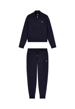 Navy blue two-piece tracksuit with zipper jacket, elastic cuffs, and drawstring pants, featuring small EA7 logos on chest and pocket.