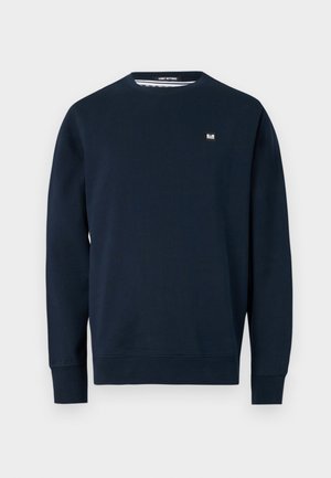Marineblauwe sweatshirt gemaakt van zachte stof, voorzien van een ronde hals, lange mouwen en een klein merkembleem op de borst. Glad textuur.