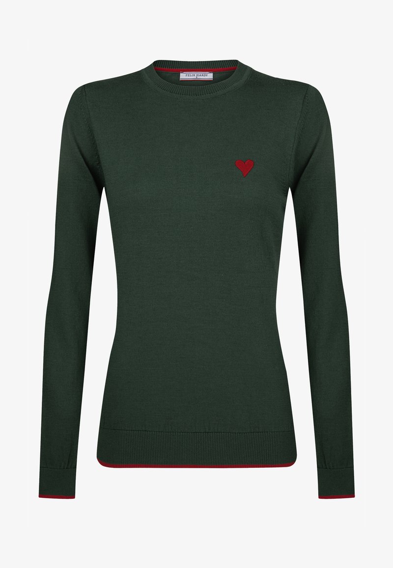 Grüner Strickpullover mit langen Ärmeln. Verfügt über ein kleines rotes Herzakzent auf der linken Brustseite und einen kontrastierenden roten Saum an den Bündchen und am unteren Rand.