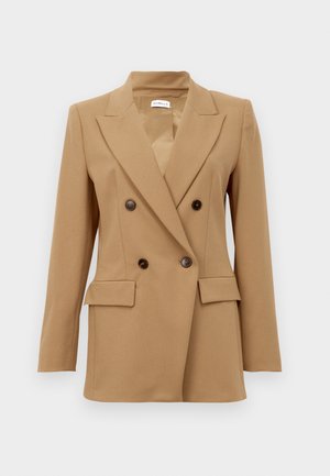Camel brown double-breasted blazer with notch lapels, four dark buttons, long sleeves, and two front flap pockets.