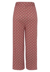 Mönstrade ankellånga byxor med en geometrisk design i röd, rosa och brun. Elastiskt midjeband och mjuk tygkvalitet.