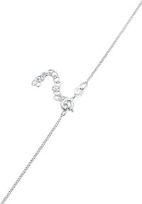 Sølv kædearmb�ånd med et fint netdesign, en lille muslingekrog og en justerbar kæde med runde led for størrelsejustering.