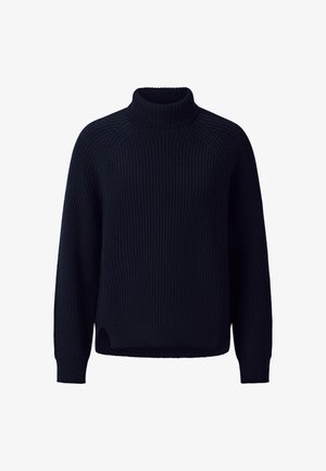 Tumedast sinine kudumiga sviiter kõrge kaelusega, raglanvarrukate ning soonilise tekstuuriga, külgedel lõhkide jaheduse jaoks.