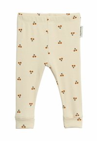 Crème-kleurige katoenen legging met een geribde textuur, met een herhalend kersenpatroon in oranje en zwart. Inclusief omslagen bij de enkels.