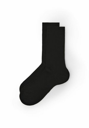 Schwarze Baumwollsocken mit glatter Textur, standardmäßiger Länge und verstärkten Zehen- und Fersenbereichen für zusätzliche Haltbarkeit.