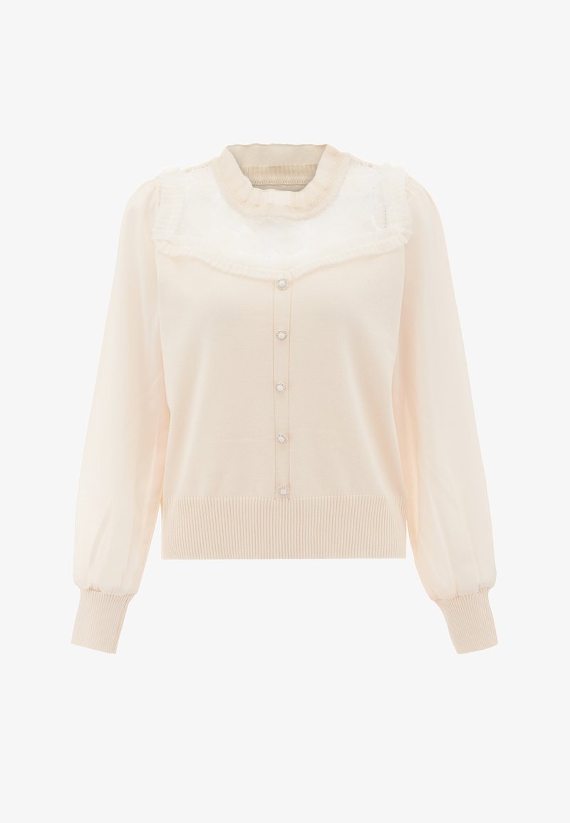 Bluză crem cu mâneci lungi, guler cu volane din dantelă, închidere cu butoane pe față și manșete și tiv cu nervuri pentru o croială structurată.