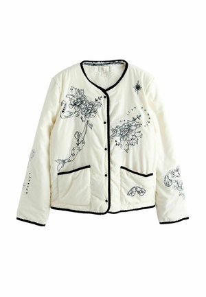 Gepolsterte weiße Jacke mit schwarzem Piping, versehen mit floralen und illustrativen schwarzen Designs, runder Ausschnitt und zwei Fronttaschen.