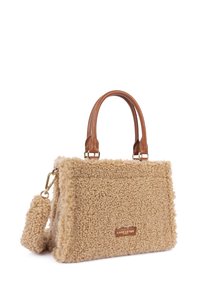 Beige faux fur handbag with brown leather handles and gold-tone hardware. Features a structured shape and a detachable strap.