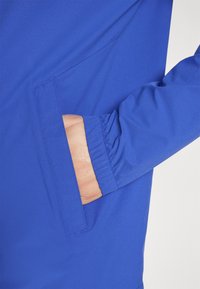 J.LINDEBERG Sports HEATH - Lauko striukė - clemantis blue
