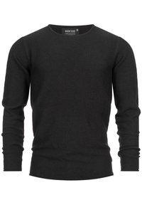 Pull noir à manches longues en tissu tricoté texturé. Doté d'un col rond et de poignets ajustés, avec un ourlet légèrement arrondi en bas.