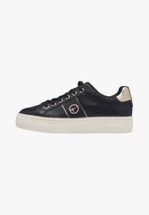 Navy leather sneaker with gold eyelets, a textured white rubber sole, and a metallic accent on the heel. Features a circular logo detail.