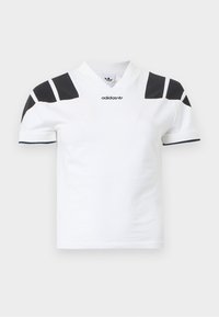 Λευκό κοντομάνικο πουκάμισο με μαύρες λεπτομέρειες στους ώμους και γιακά. Διαθέτει σχέδιο με V-λαιμόκοψη και λογότυπο Adidas στο μπροστινό μέρος. Υλικό από βαμβάκι.