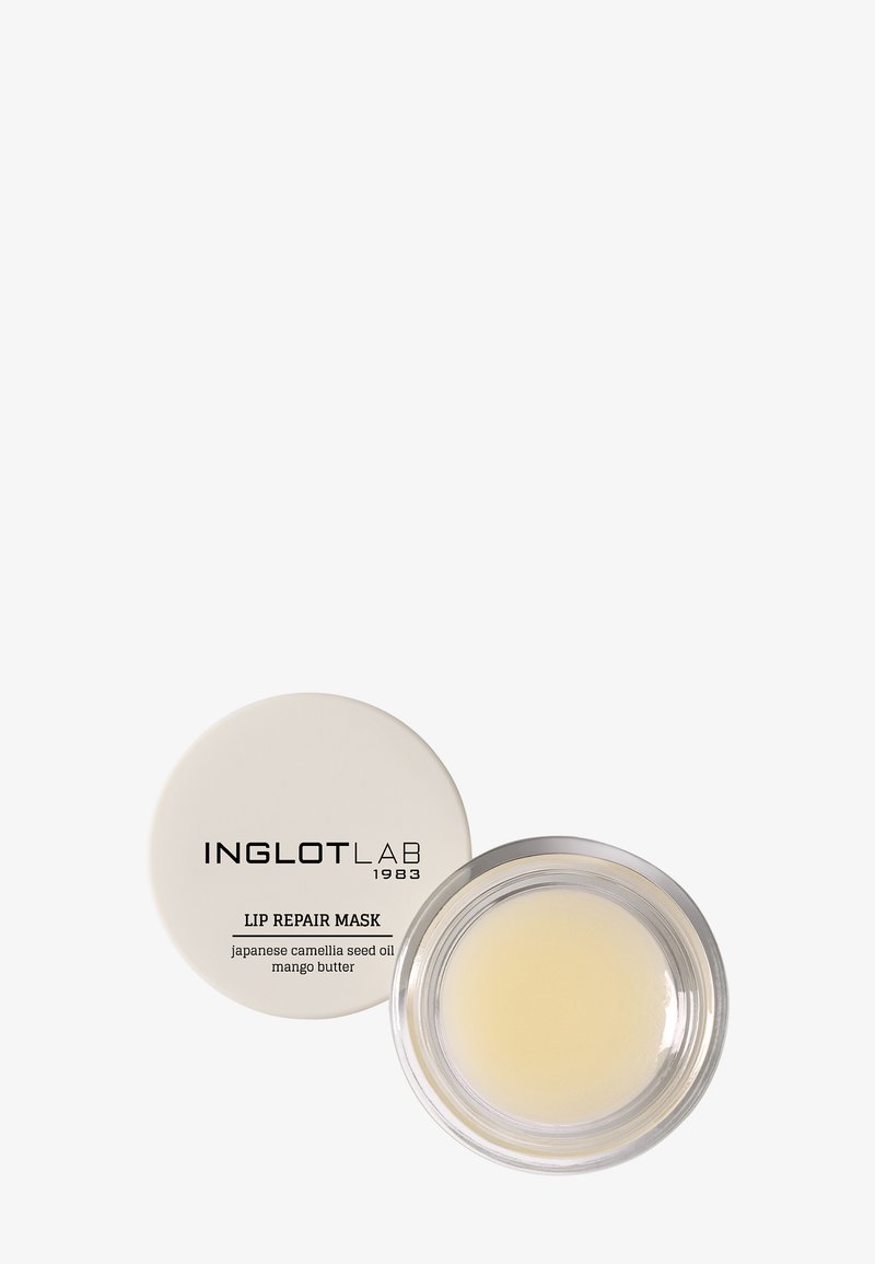 Clear round jar of Inglot Lab lip repair mask with white lid showing product name and ingredients Japanese camellia seed oil and mango butter.