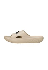Infradito beige realizzati in plastica liscia, con punta aperta e lati intagliati. Suola testurizzata con bordi rigati e accento del logo nero.