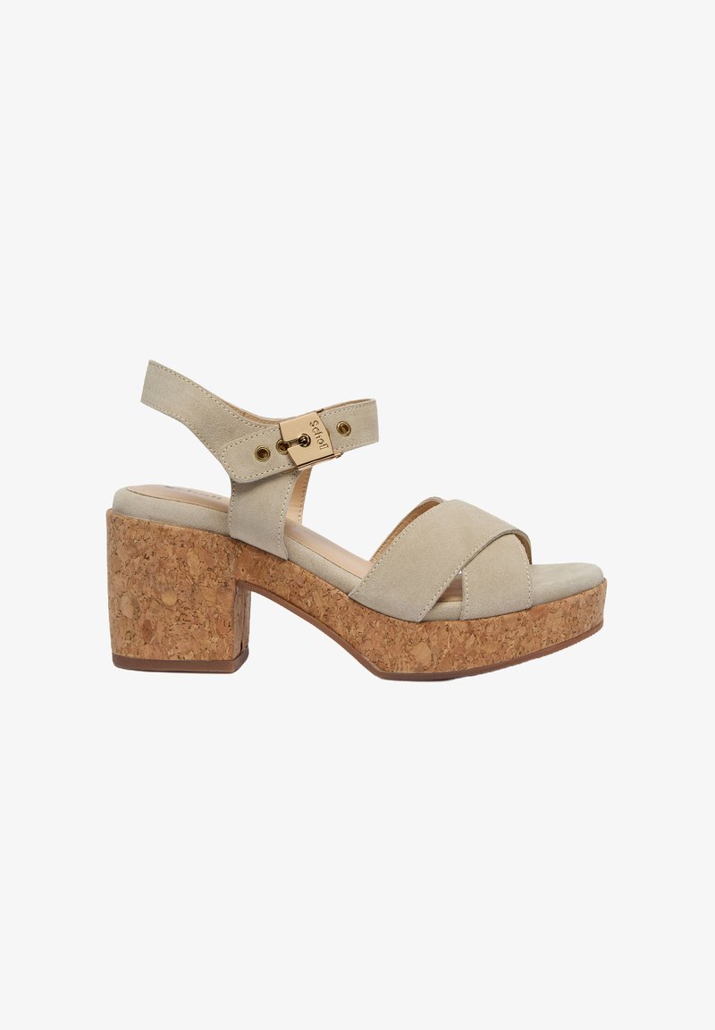 Beige suede platform sandals with cork block heel, crossed front straps, adjustable ankle strap, and gold-colored buckle detail.