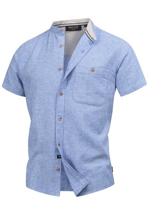 Short-sleeve, light blue button-up shirt with a textured pattern, a chest pocket, and contrasting collar detail. Features brown buttons.
