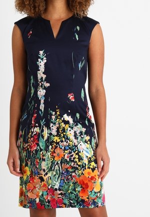 Navy blue floral dress with cap sleeves, featuring vibrant multicolored floral patterns at the hem and subtle v-neck design.