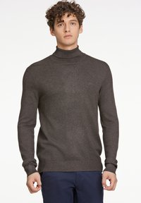 Mörkgrå polotröja med långa ärmar, ribbade muddar och fåll. Tyget verkar lätt och mjukt, i en figurnära stil utan dekorationer.