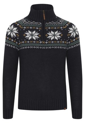 Tumši zils adīts džemperis ar rāvējslēdzēja kaklu. Ir rakstots yoke ar baltām sniegpārsliņām, zaļām, dzeltenām un baltām akcentiem. Ribotas aproces un apakšmalas.