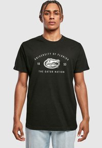 Merchcode UNIVERSITY OF FLORIDA - THE GATOR NATION - Triko s potiskem - black