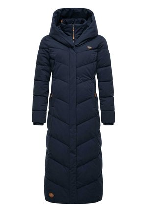 Long navy puffer coat with a high collar, featuring chevron stitching, side pockets with brown accents, and a zip-up front. Smooth texture.