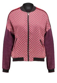 Red and purple bomber jacket with diamond pattern, ribbed collar, and cuffs. Features zip closure and side pockets, made from smooth, textured fabric.