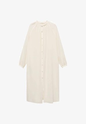 Dolga svetlo kremna obleka s krožnim izrezom, polnimi rokavi, gumbnim zapiranjem spredaj in sproščenim krojem. Narejena iz mehkega, lahkotnega materiala.