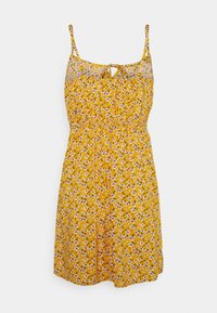 Gul blommig klänning med tunna band, plisserad midja och nyckelhålsdetalj vid halsringningen, med ett litet tusenskönemönster.