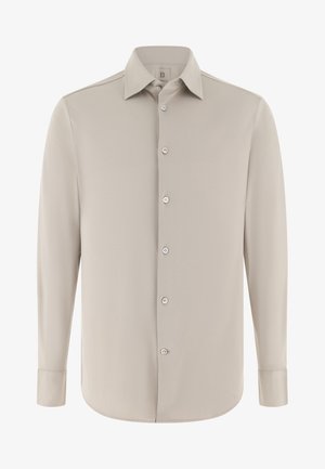Hellbeiges langärmliges Hemd mit klassischem Kragen, durchgehender Knopfleiste und geknöpften Manschetten. Glatter Stoff ohne sichtbare Muster oder Akzente.