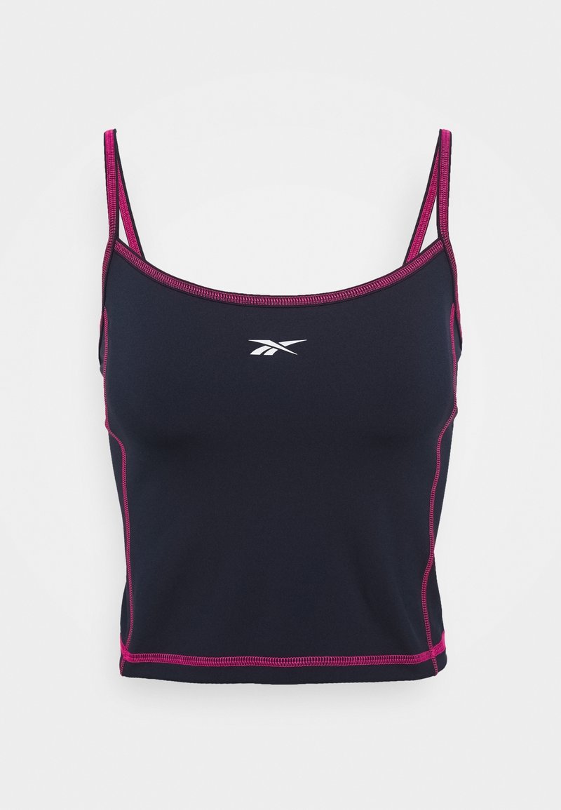 Crop top de sport noir avec coutures roses et fines bretelles, avec un logo blanc Reebok sur la poitrine.