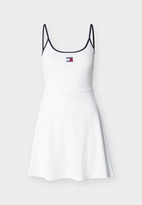 Λευκό αμάνικο φόρεμα με ναυτικό τόξο, εφαρμοστό μπούστο, φούστα που ανοίγει και μικρό λογότυπο Tommy Jeans στο κέντρο του στήθους.