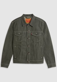 Grön denimjacka med klassisk design, som har två bröstfickor, knappstängning och kontrasterande vit söm.