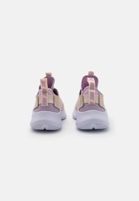 Purple and beige athletic shoes featuring a textured upper, padded collar, and logo-printed heel tabs. Rubber outsole with a traction pattern.