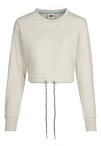 Kappet, lys beige genser laget av mykt stoff. Har rund hals, lange ermer og en justerbar snor i kanten med mønstrede detaljer.