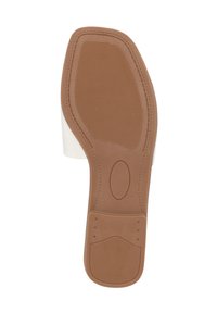 Suola in gomma marrone con grip tessurizzato, caratterizzata da un bordo superiore bianco. La forma è leggermente curva, aumentando la stabilità durante l'uso.