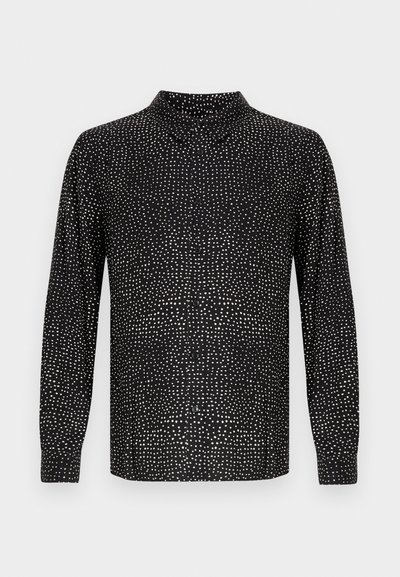 Schwarzes Langarmshirt mit hohem Kragen, durchgeknöpft und mit weißem Punktmuster über den gesamten Stoff. Glatter Stoff mit lockerem Schnitt.