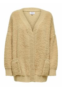 Béžový texturovaný kardigan s výstřihem do V, žebrovanými manžetami a dvěma předními kapsami. Povrch je měkký a chlupatý, což vytváří útulný vzhled.
