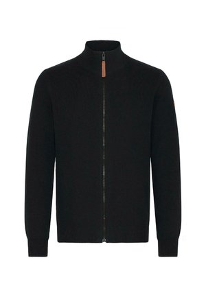 Melna zipa džemperis ar augstu apkakli, ribotiem piedurkņu galiem un jostasvietu. Gluda adīšana ar brūnas ādas rāvējslēdzēja vilkšanas detaļu.