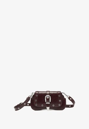 Burgundy leather crossbody bag with silver hardware, featuring belt buckle closure and grommet accents on the flap and strap.
